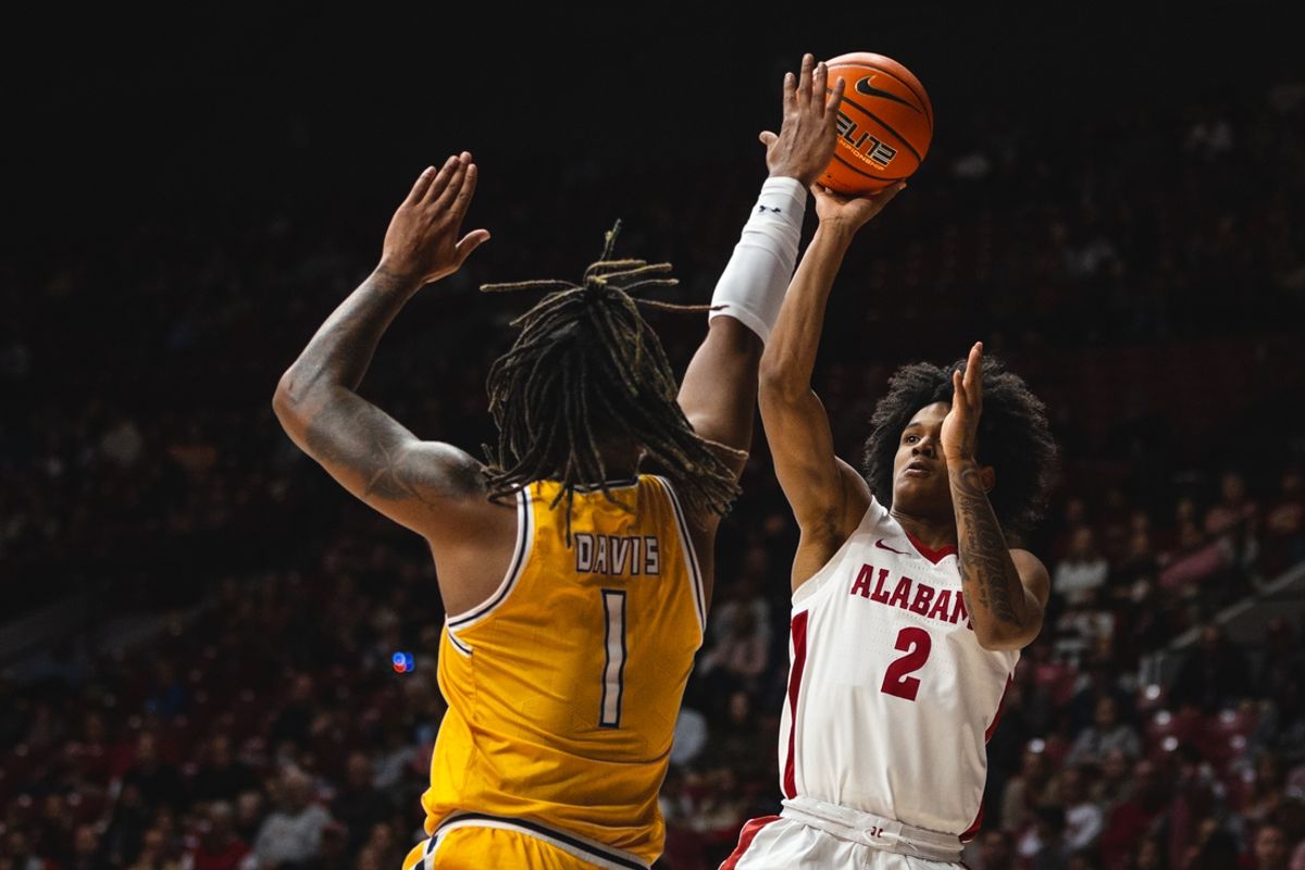 Dec 22, 2024; Tuscaloosa, Alabama, USA; Alabama Crimson Tide guard Aden Holloway (2) shoots against Kent State Golden Flashes forward VonCameron Davis (1) during the first half at Coleman Coliseum. Mandatory Credit: Will McLelland-Imagn Images