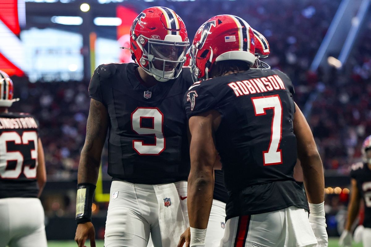 Dec 22, 2024; Atlanta, Georgia, USA; Atlanta Falcons running back Bijan Robinson (7) celebrates after a touchdown with quarterback Michael Penix Jr. (9) against the New York Giants in the second quarter at Mercedes-Benz Stadium. Mandatory Credit: Brett Davis-Imagn Images