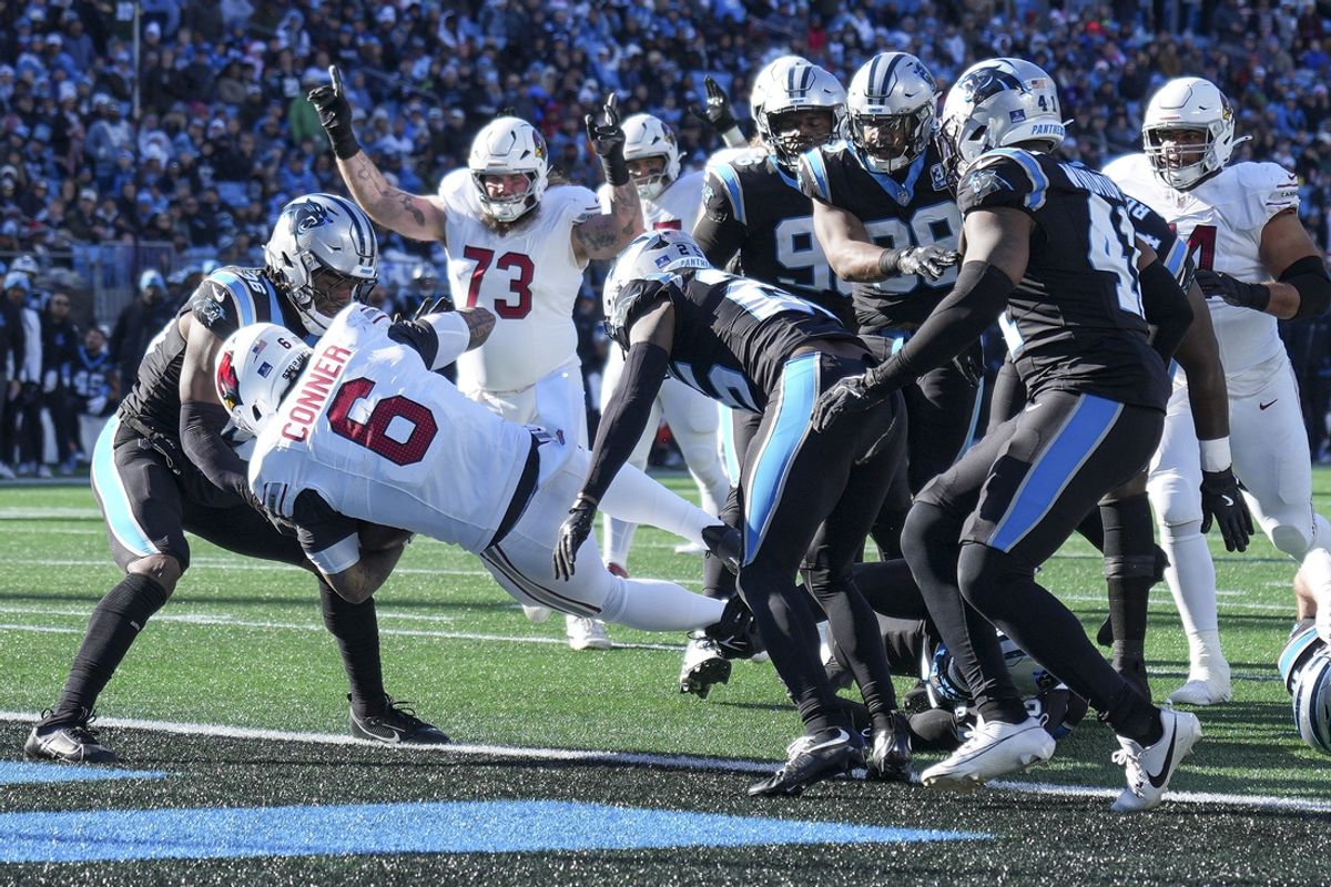 Dec 22, 2024; Charlotte, North Carolina, USA;  Arizona Cardinals running back James Conner (6) runs for a touchdown score against the Carolina Panthers during the second quarter at Bank of America Stadium. Mandatory Credit: Jim Dedmon-Imagn Images