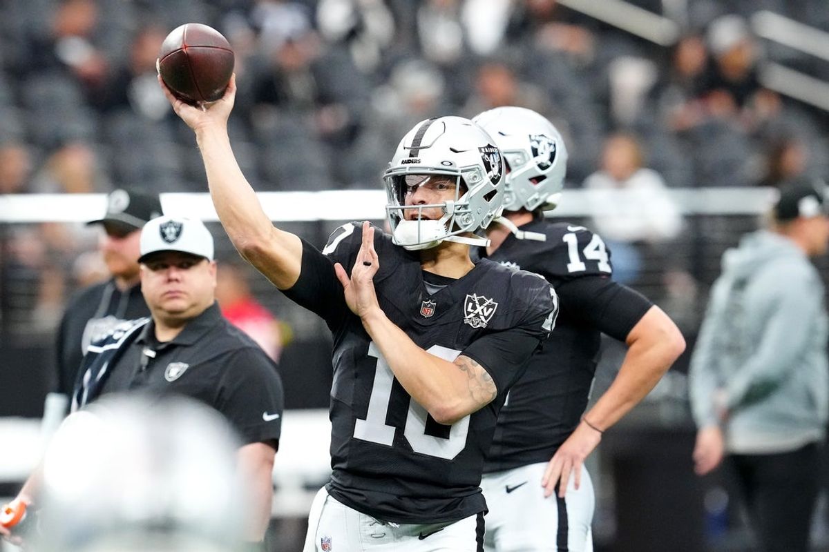 Dec 22, 2024; Paradise, Nevada, USA; Las Vegas Raiders quarterback Desmond Ridder (10) warms up before a game against the Jacksonville Jaguars at Allegiant Stadium. Mandatory Credit: Stephen R. Sylvanie-Imagn Images