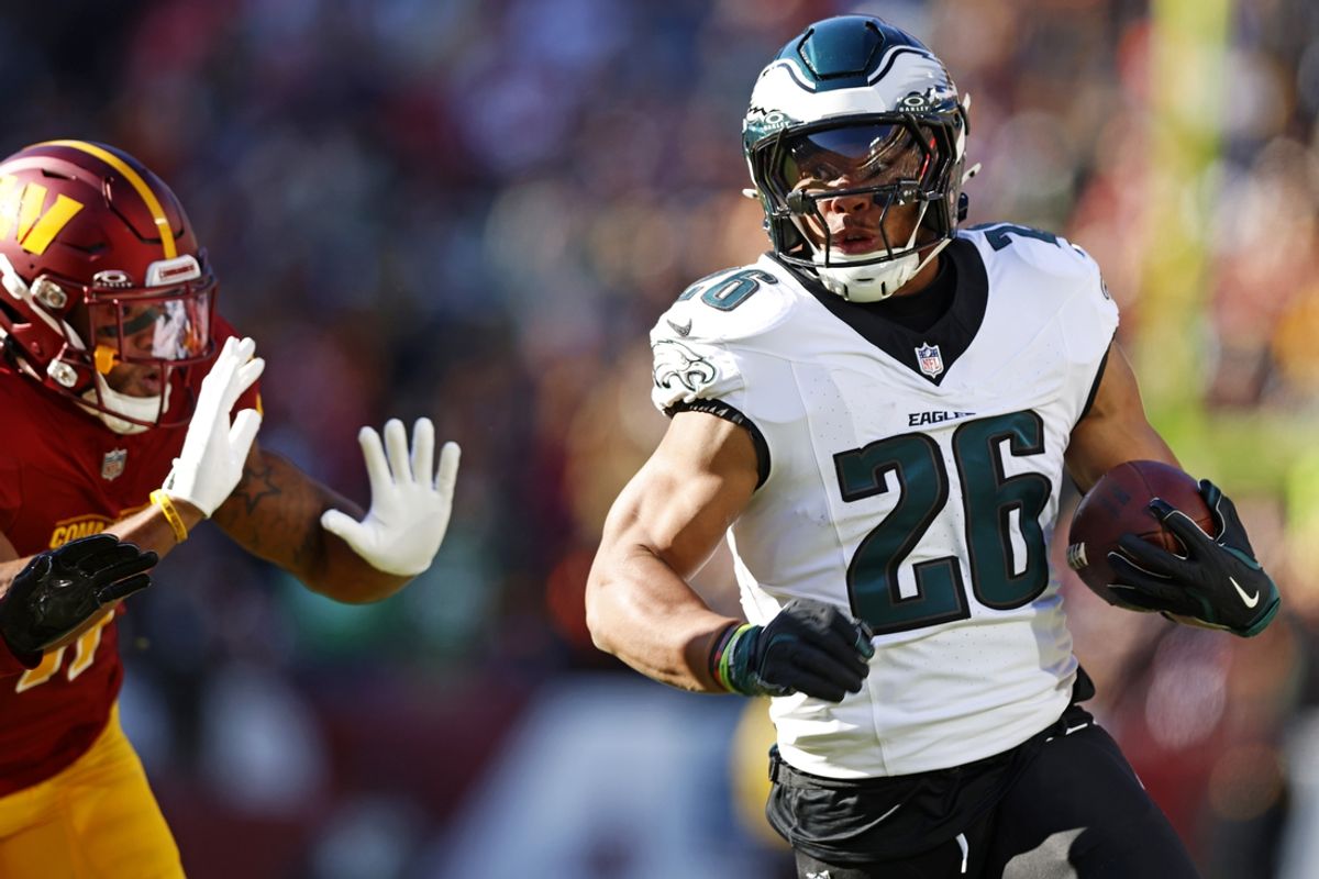 Eagles running back Saquon Barkley (26) runs the ball during the first quarter against the Washington Commanders at Northwest Stadium. Mandatory Credit: Peter Casey-Imagn Images