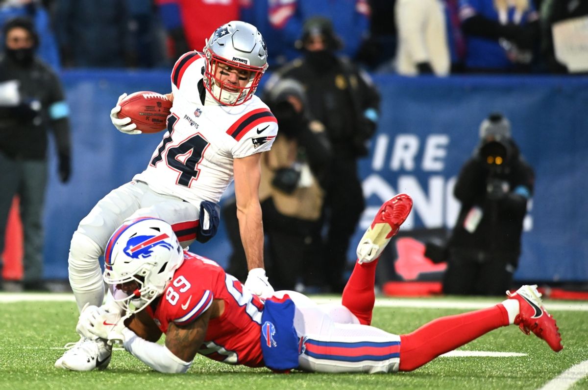 Dec 22, 2024; Orchard Park, New York, USA; New England Patriots wide receiver Alex Erickson (14) is tackled by Buffalo Bills wide receiver Jalen Virgil (89) on a kickoff return in the first quarter at Highmark Stadium. Mandatory Credit: Mark Konezny-Imagn Images