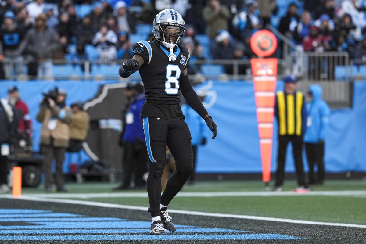 Dec 22, 2024; Charlotte, North Carolina, USA; Carolina Panthers cornerback Jaycee Horn (8) questions a call by the official  during the second half against the Arizona Cardinals at Bank of America Stadium. Mandatory Credit: Jim Dedmon-Imagn Images