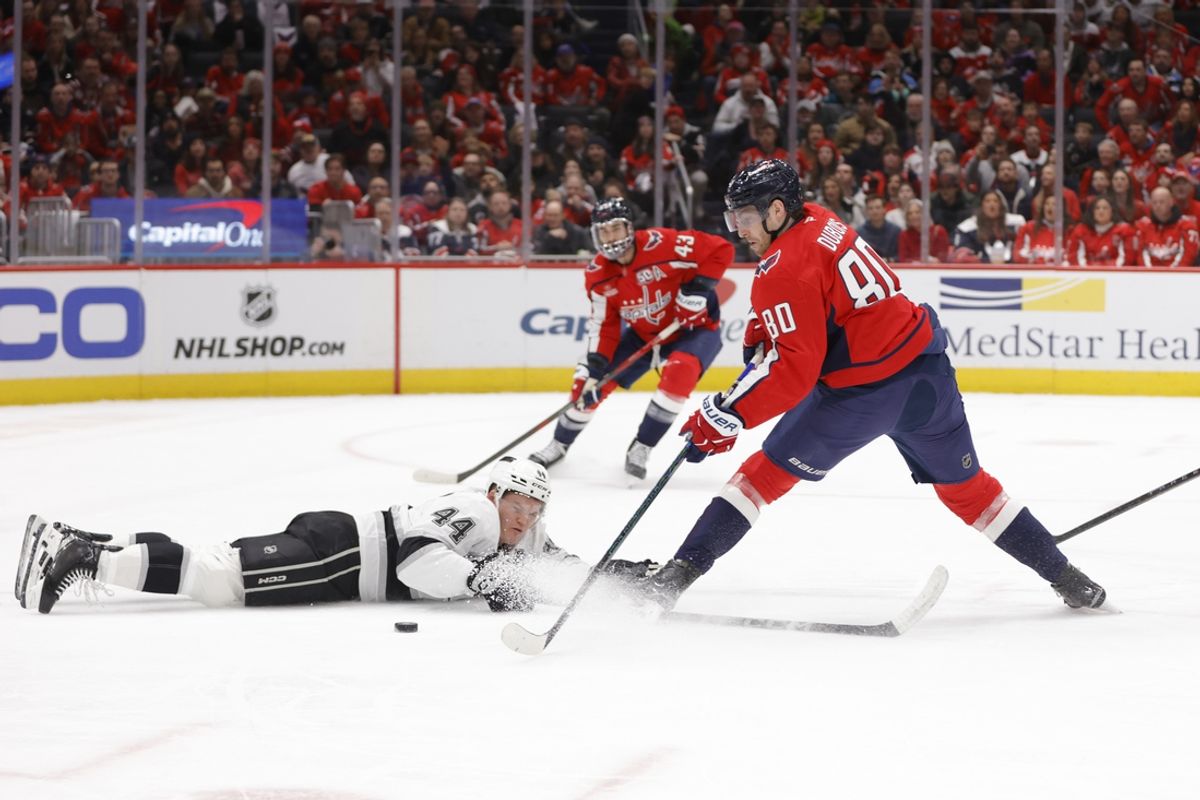 Dec 22, 2024; Washington, District of Columbia, USA; Washington Capitals left wing Pierre-Luc Dubois (80) controls the puck as Los Angeles Kings defenseman Mikey Anderson (44) defends during the first period at Capital One Arena. Mandatory Credit: Amber Searls-Imagn Images