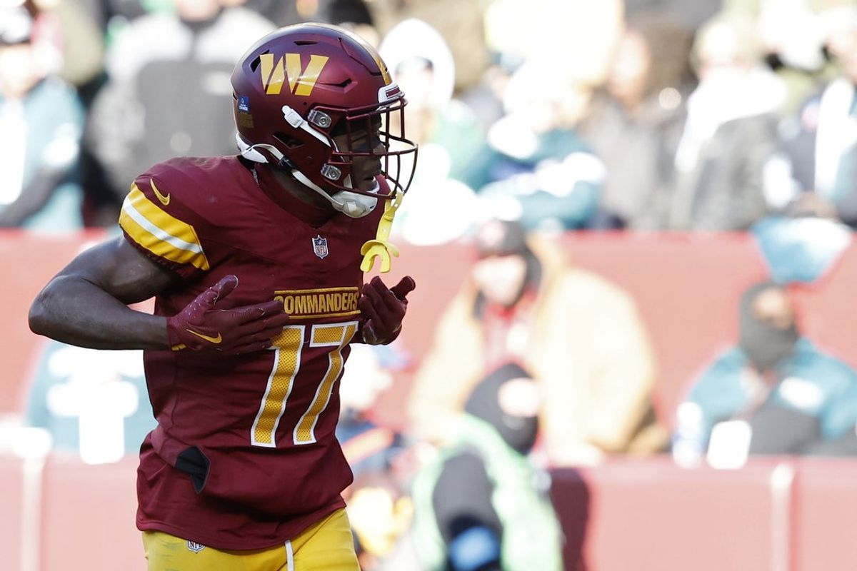 Dec 22, 2024; Landover, Maryland, USA; Washington Commanders wide receiver Terry McLaurin (17) celebrates after catching a touchdown pass against the Philadelphia Eagles during the second quarter at Northwest Stadium. Mandatory Credit: Geoff Burke-Imagn Images