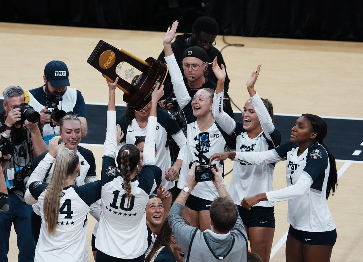 Penn State celebrated with the trophy after they defeated Louisville 3 sets to 1 to win the NCAA Championship Volleyball match at the KFC Yum! Center in Louisville, Ky. on Dec. 22, 2024.