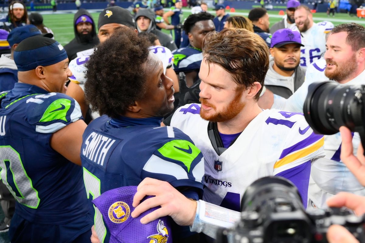 Dec 22, 2024; Seattle, Washington, USA; Seattle Seahawks quarterback Geno Smith (7) and Minnesota Vikings quarterback Sam Darnold (14) hug after the game at Lumen Field. Mandatory Credit: Steven Bisig-Imagn Images