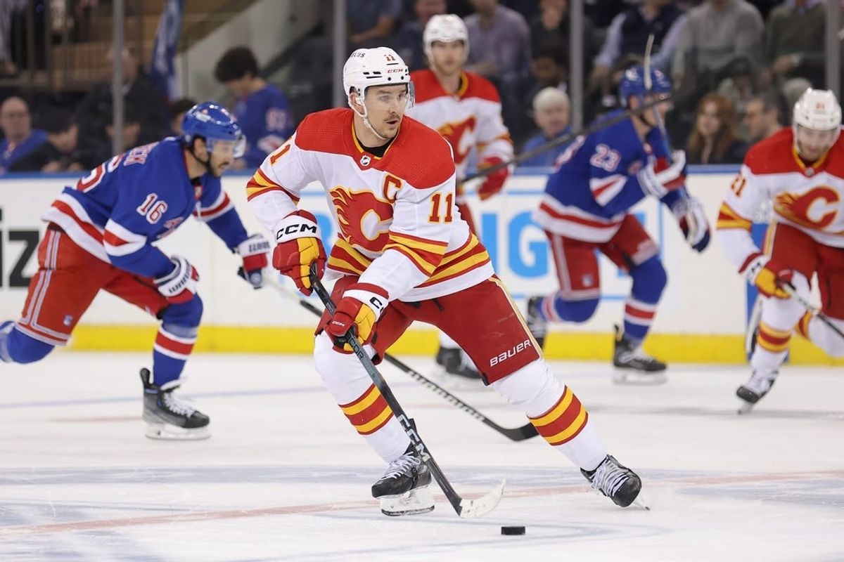Feb 12, 2024; New York, New York, USA; Calgary Flames center Mikael Backlund (11) skates with the puck against the New York Rangers during the second period at Madison Square Garden.