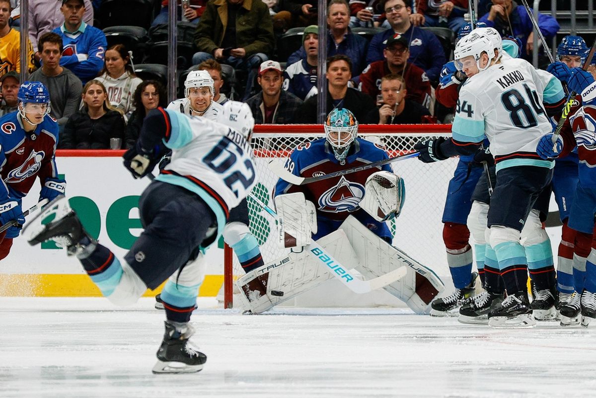 Dec 22, 2024; Denver, Colorado, USA; Seattle Kraken defenseman Brandon Montour (62) attempts a shot against Colorado Avalanche goaltender Mackenzie Blackwood (39) as right wing Kaapo Kakko (84) defends in the second period at Ball Arena. Mandatory Credit: Isaiah J. Downing-Imagn Images