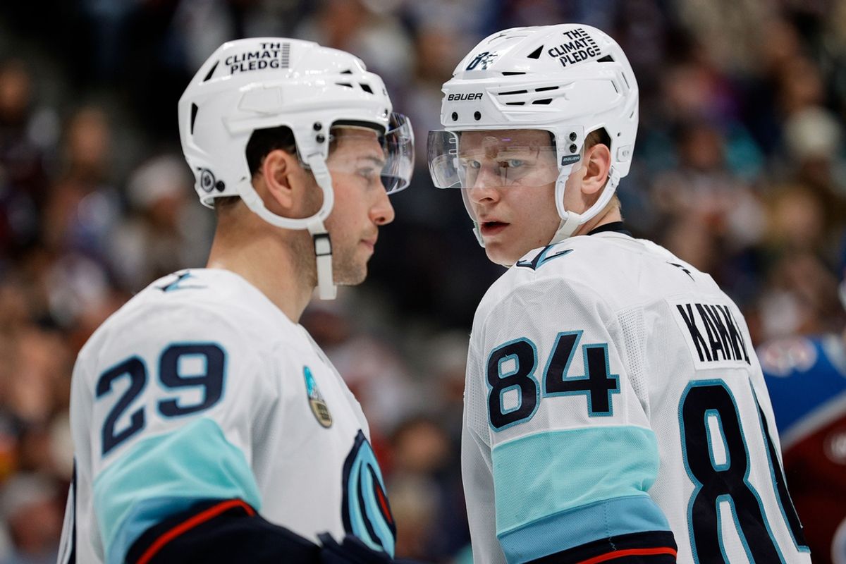 Dec 22, 2024; Denver, Colorado, USA; Seattle Kraken right wing Kaapo Kakko (84) and defenseman Vince Dunn (29) in the second period against the Colorado Avalanche at Ball Arena. Mandatory Credit: Isaiah J. Downing-Imagn Images