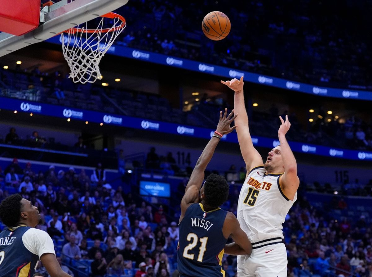 Dec 22, 2024; New Orleans, Louisiana, USA; Denver Nuggets center Nikola Jokic (15) shoots over New Orleans Pelicans center Yves Missi (21) during overtime at Smoothie King Center. Mandatory Credit: Matthew Hinton-Imagn Images