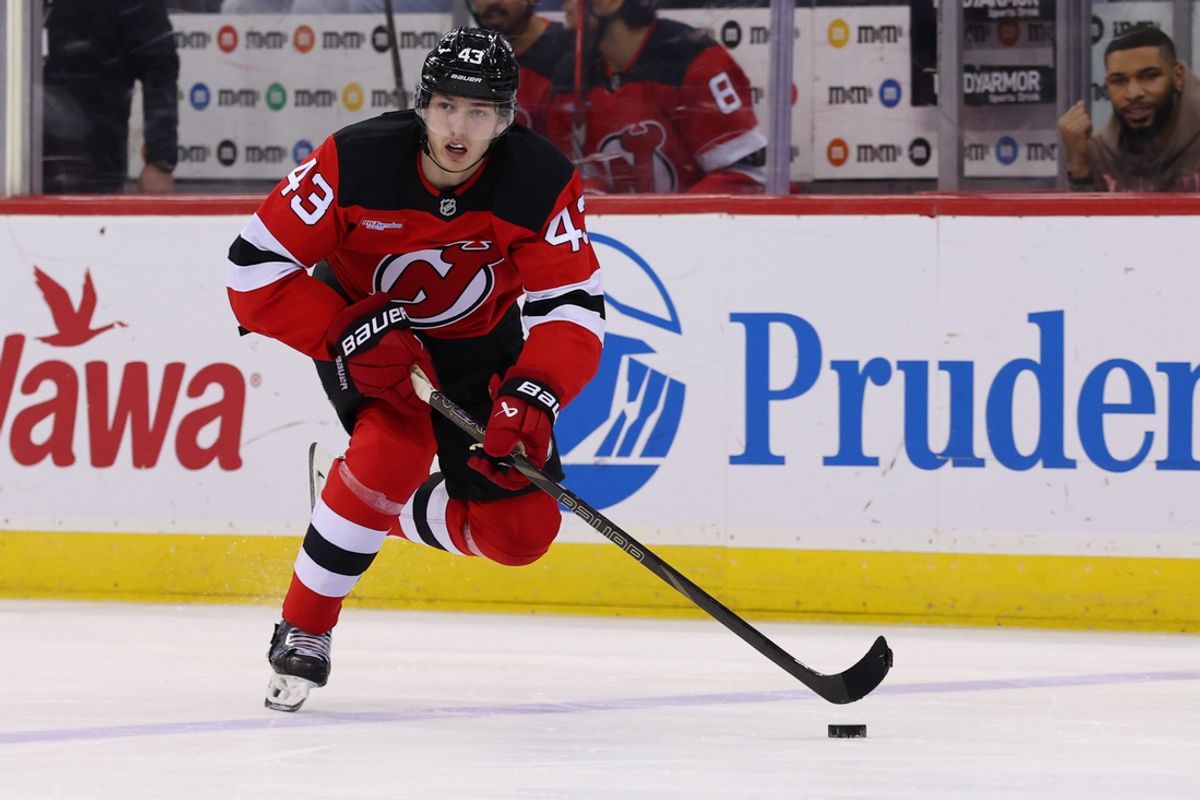 Dec 23, 2024; Newark, New Jersey, USA; New Jersey Devils defenseman Luke Hughes (43) skates with the puck against the New York Rangers during the second period at Prudential Center. Mandatory Credit: Ed Mulholland-Imagn Images