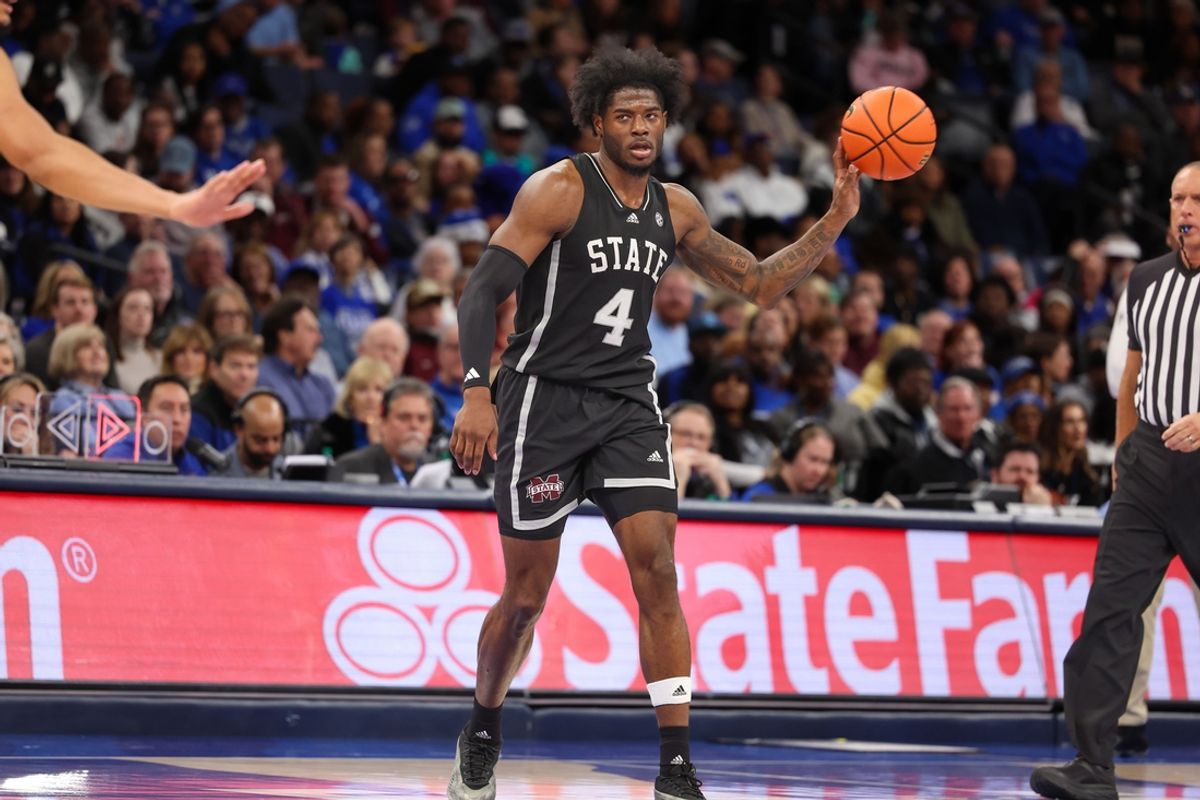 Dec 21, 2024; Memphis, Tennessee, USA; Mississippi State Bulldogs forward Cameron Matthews (4) passes the ball against the Memphis Tigers during the second half at FedExForum. Mandatory Credit: Wesley Hale-Imagn Images