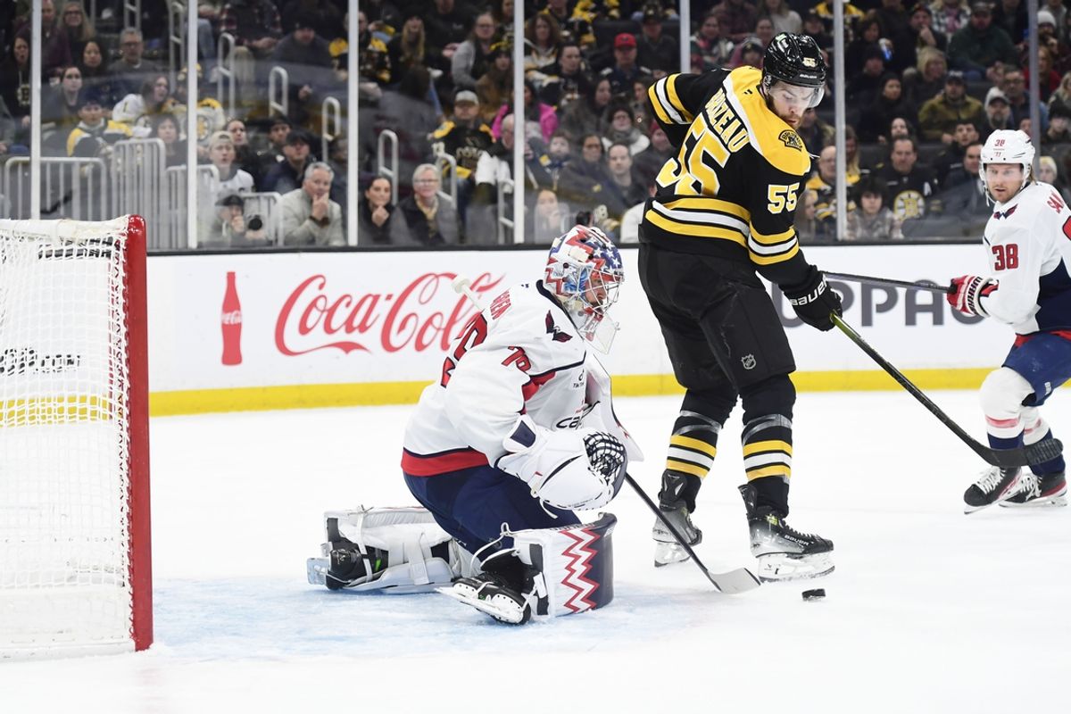 Dec 23, 2024; Boston, Massachusetts, USA;  Boston Bruins right wing Justin Brazeau (55) looks for a rebound in front of Washington Capitals goaltender Charlie Lindgren (79) during the first period at TD Garden. Mandatory Credit: Bob DeChiara-Imagn Images