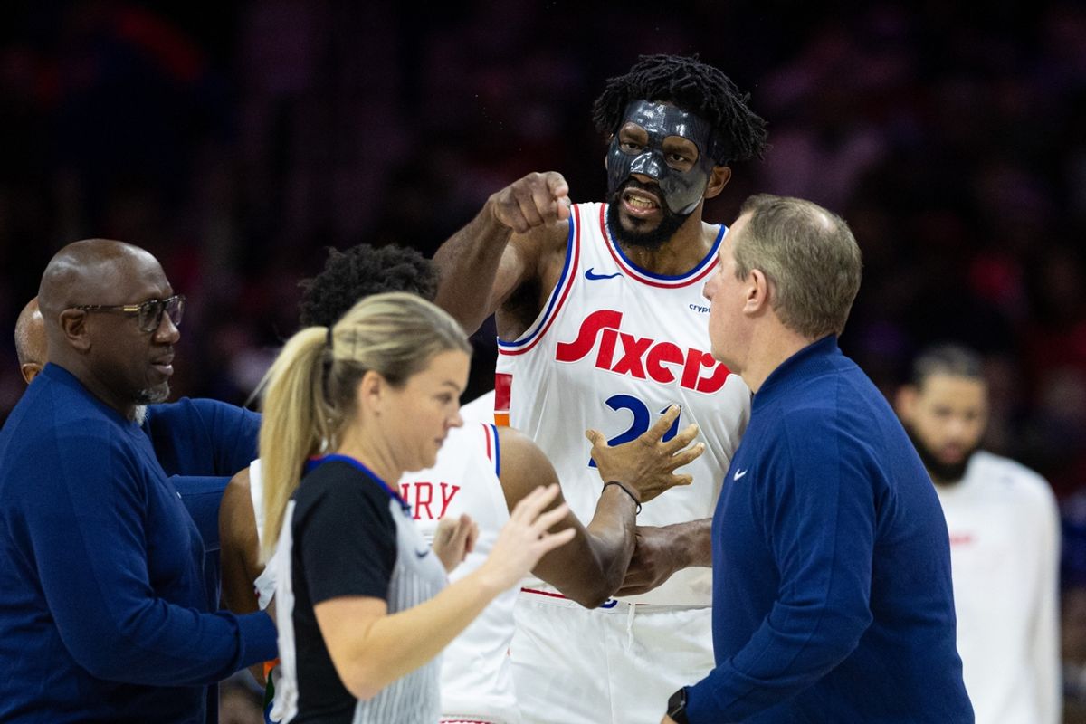 Dec 23, 2024; Philadelphia, Pennsylvania, USA; Philadelphia 76ers center Joel Embiid (21) argues with  referee Jenna Schroeder (20) and is ejected on a second technical foul during the second quarter against the San Antonio Spurs at Wells Fargo Center. Mandatory Credit: Bill Streicher-Imagn Images
