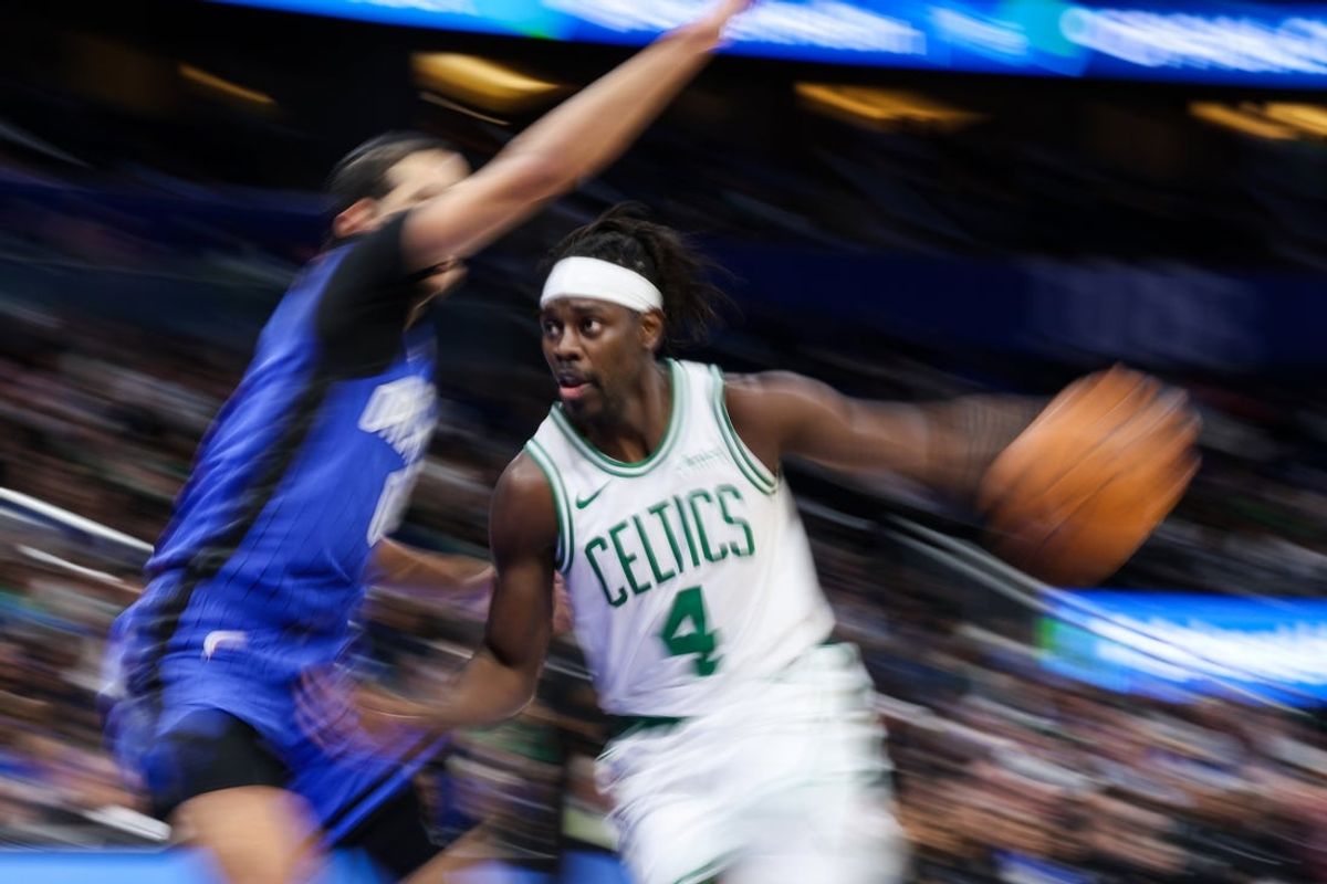 Dec 23, 2024; Orlando, Florida, USA; Boston Celtics guard Jrue Holiday (4) drives to the basket against the Orlando Magic in the second quarter at Kia Center. Mandatory Credit: Nathan Ray Seebeck-Imagn Images