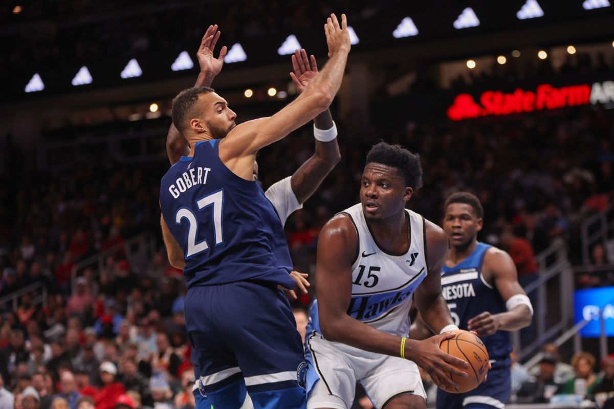 Dec 23, 2024; Atlanta, Georgia, USA; Atlanta Hawks center Clint Capela (15) is defended by Minnesota Timberwolves center Rudy Gobert (27) in the second quarter at State Farm Arena. Mandatory Credit: Brett Davis-Imagn Images