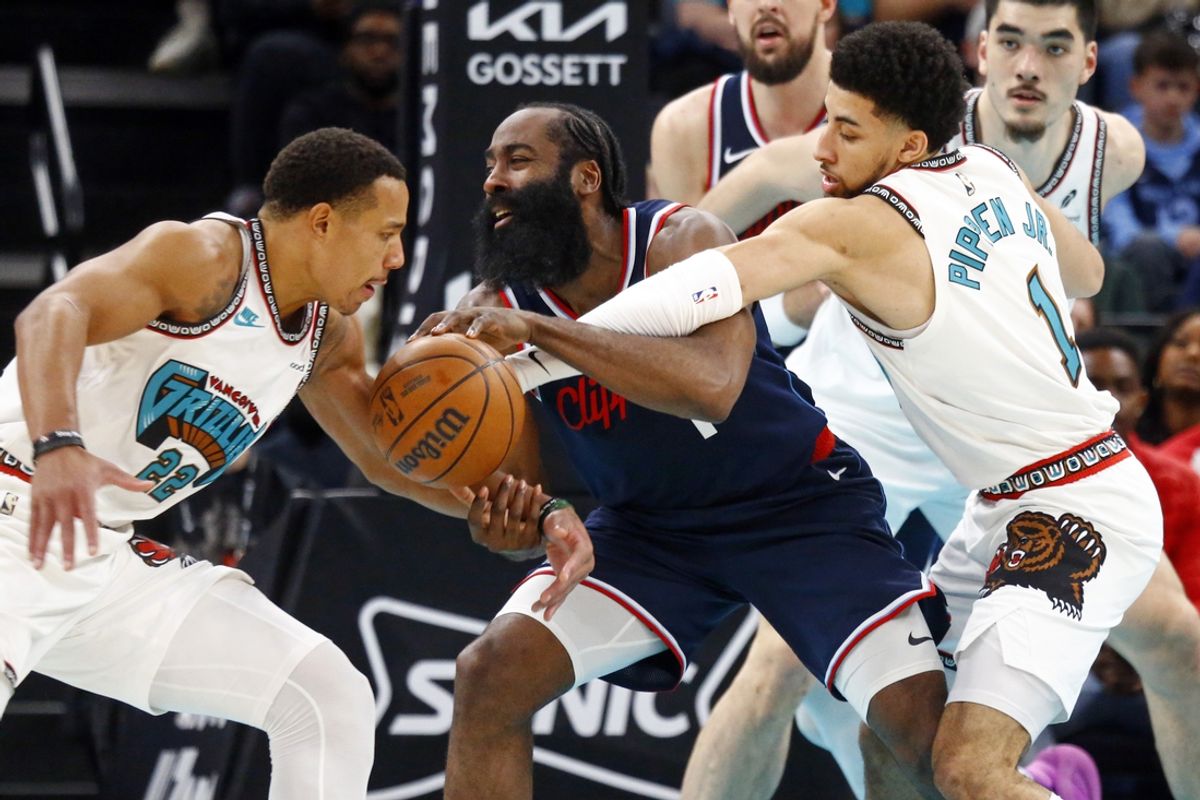 Dec 23, 2024; Memphis, Tennessee, USA; Los Angeles Clippers guard James Harden (1) handles the ball as Memphis Grizzlies guard Desmond Bane (22) and guard Scotty Pippen Jr. (1) defend during the second quarter at FedExForum. Mandatory Credit: Petre Thomas-Imagn Images