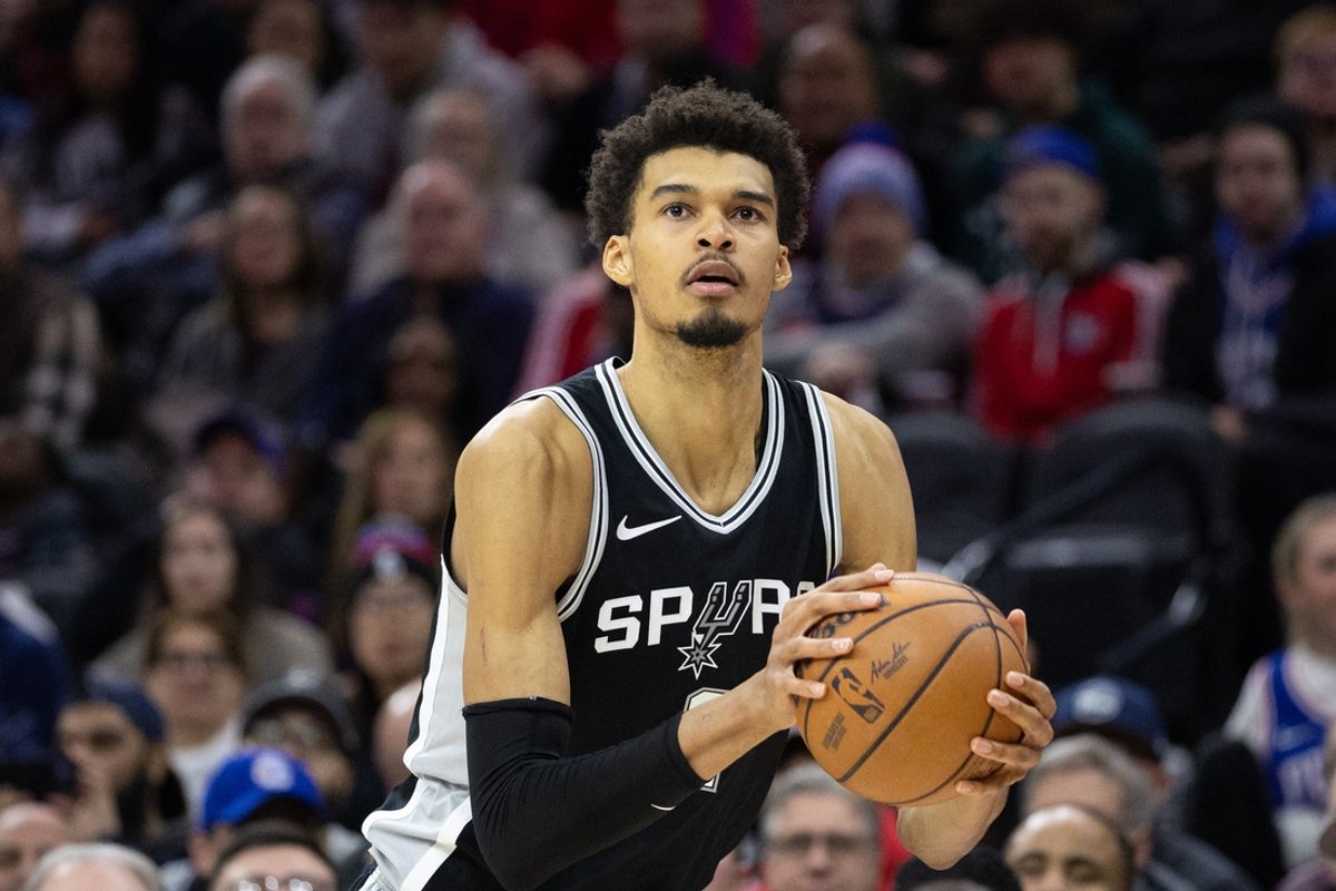 Dec 23, 2024; Philadelphia, Pennsylvania, USA; San Antonio Spurs center Victor Wembanyama (1) shoots the ball against the Philadelphia 76ers during the fourth quarter at Wells Fargo Center. Mandatory Credit: Bill Streicher-Imagn Images