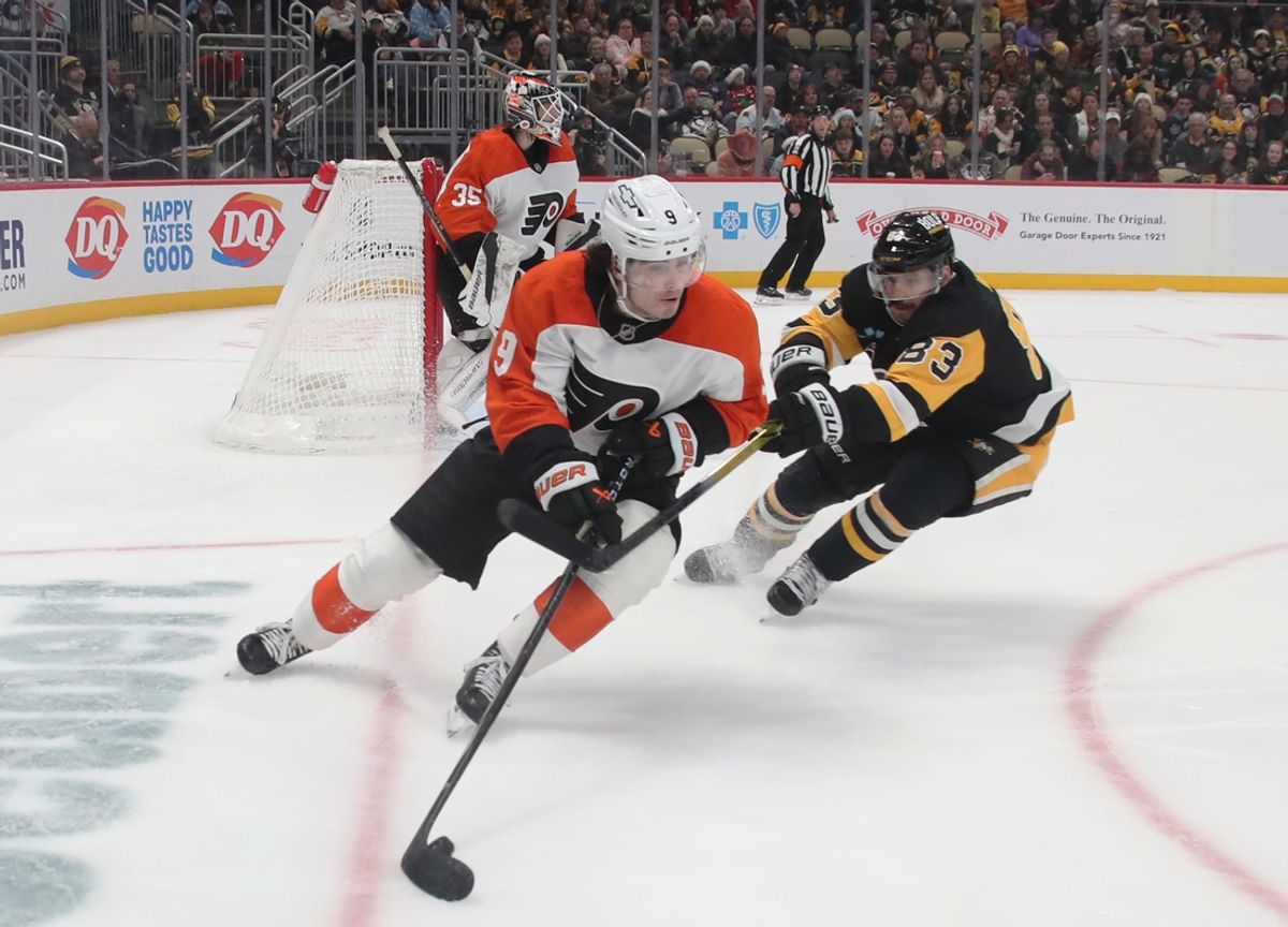 Dec 23, 2024; Pittsburgh, Pennsylvania, USA; Philadelphia Flyers defenseman Jamie Drysdale (9) moves the puck against Pittsburgh Penguins left wing Matt Nieto (83) during the third period at PPG Paints Arena. Mandatory Credit: Charles LeClaire-Imagn Images