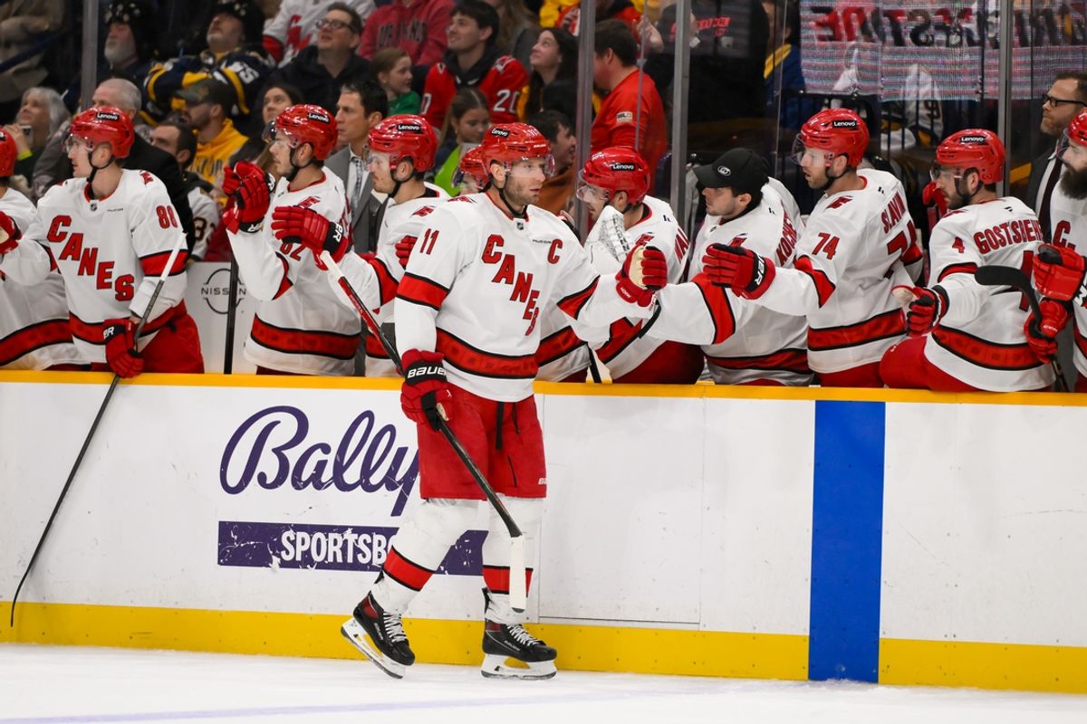 Dec 23, 2024; Nashville, Tennessee, USA;  Carolina Hurricanes center Jordan Staal (11) celebrates his goal with his teammates  against the Nashville Predators during the third period at Bridgestone Arena. Mandatory Credit: Steve Roberts-Imagn Images