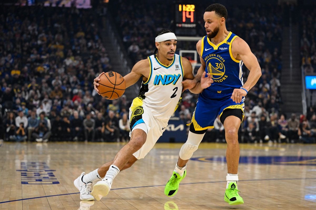 Dec 23, 2024; San Francisco, California, USA; Indiana Pacers guard Andrew Nembhard (2) drives to the basket against Golden State Warriors guard Stephen Curry (30) in the first quarter at Chase Center. Mandatory Credit: Eakin Howard-Imagn Images