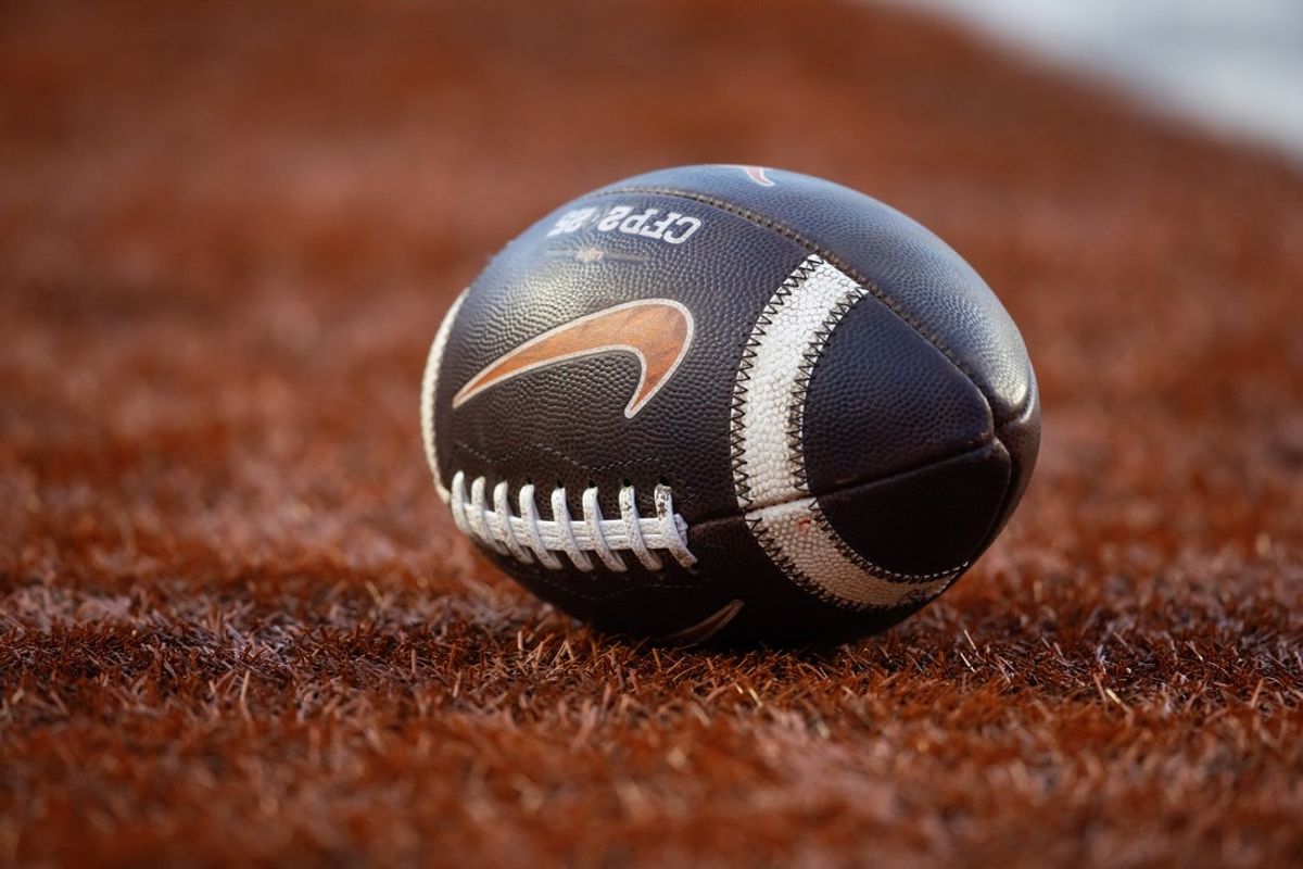 Dec 21, 2024; Austin, Texas, USA; Detailed view of a Nike logo on an official NCAA football during the Clemson Tigers game against the Texas Longhorns in the CFP National playoff first round at Darrell K Royal-Texas Memorial Stadium. Mandatory Credit: Mark J. Rebilas-Imagn Images