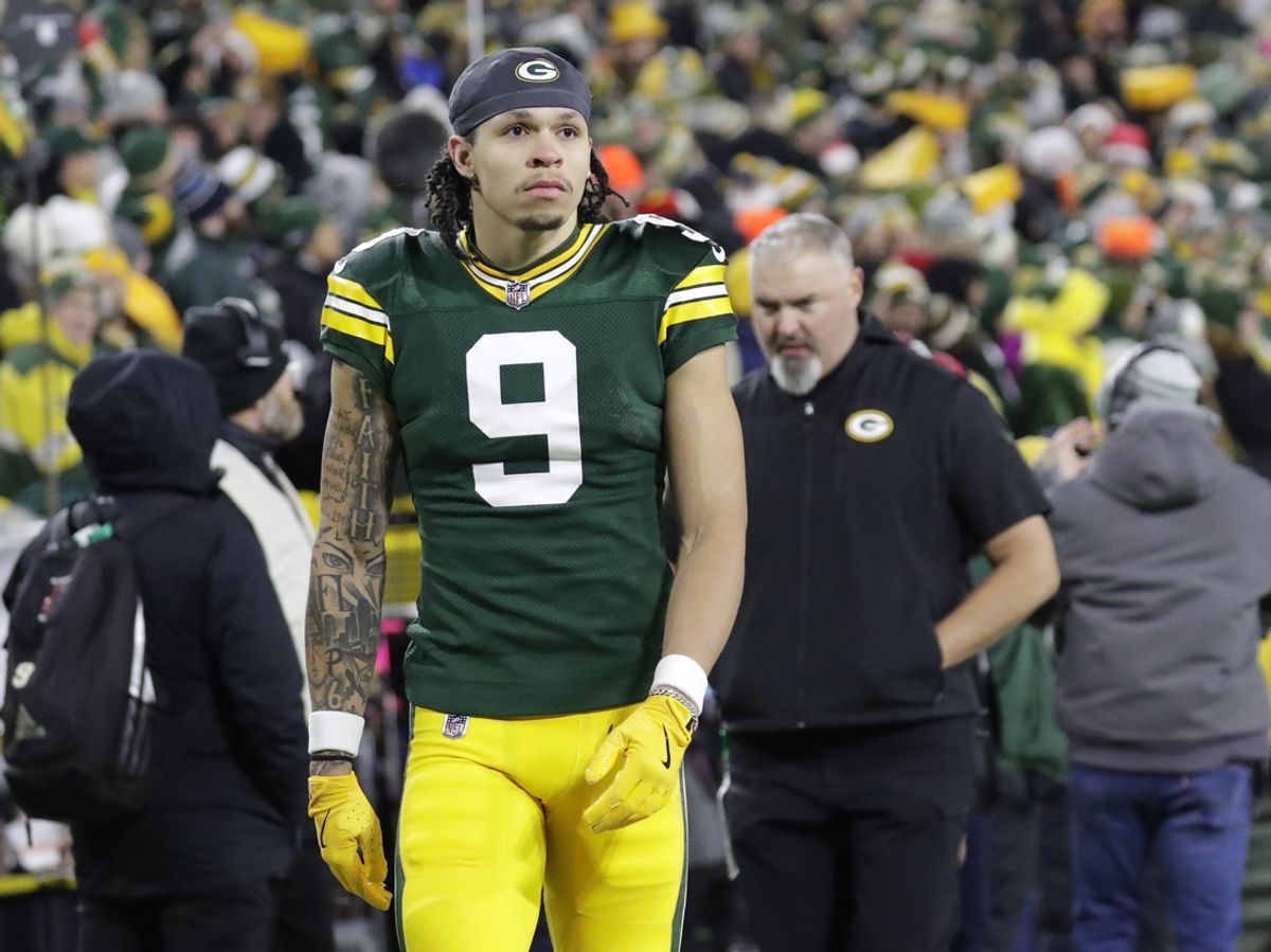 Dec 23, 2024; Green Bay, Wisconsin, USA;  Green Bay Packers wide receiver Christian Watson (9) leaves the field in the fourth quarter after getting injured against the New Orleans Saints at Lambeau Field. Mandatory Credit: Dan Powers-USA TODAY NETWORK/Imagn Images