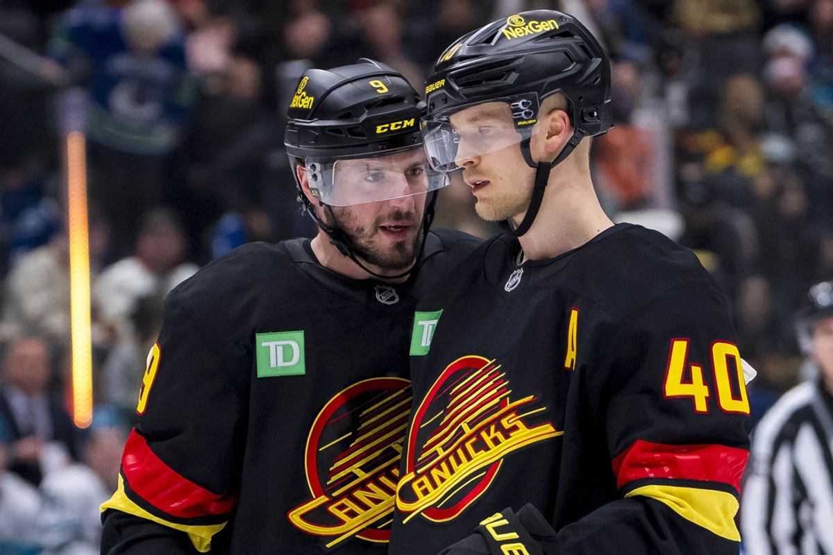 Dec 23, 2024; Vancouver, British Columbia, CAN; Vancouver Canucks forward J.T. Miller (9) and forward Elias Pettersson (40) talk during a stop in play against the San Jose Sharks in the first period at Rogers Arena. Mandatory Credit: Bob Frid-Imagn Images