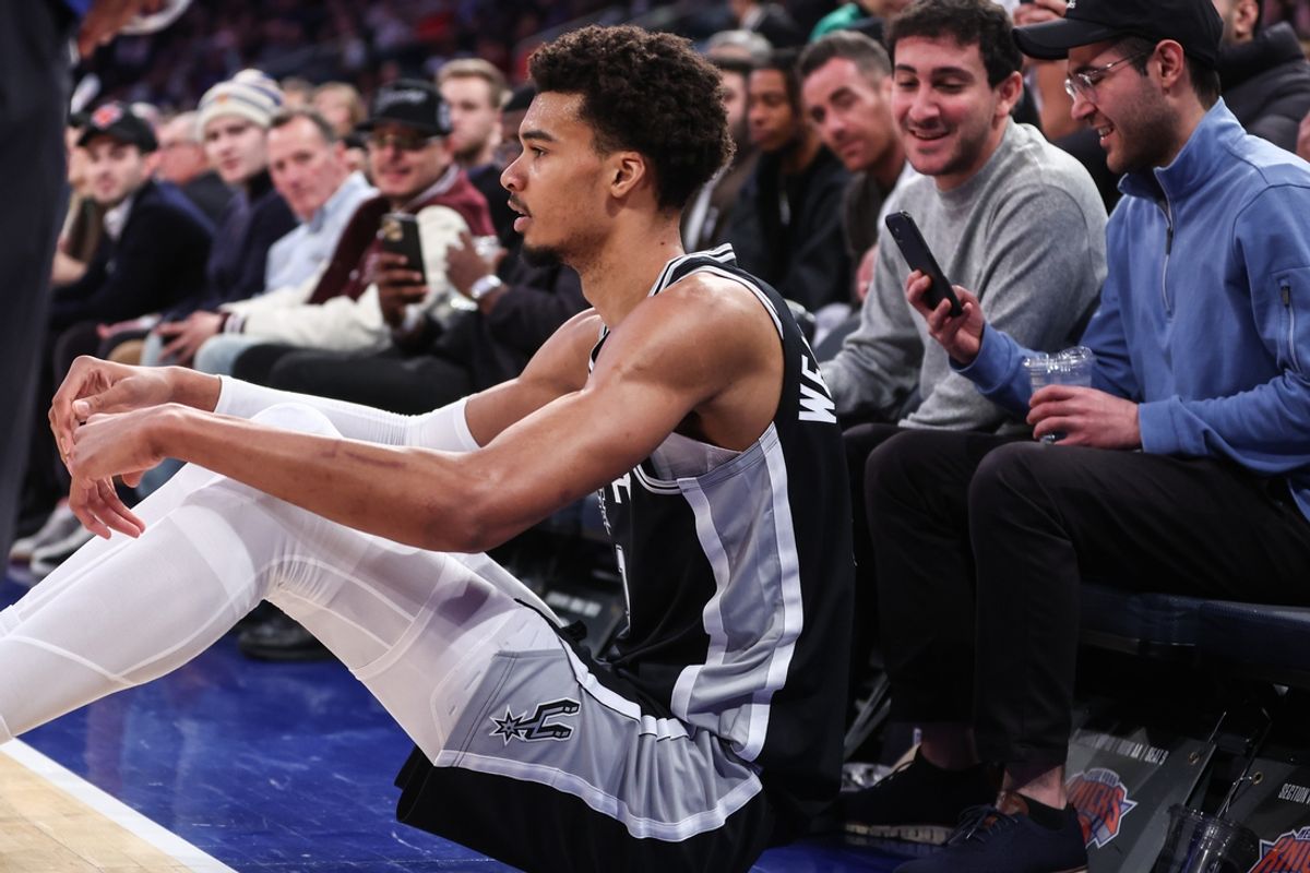 Dec 25, 2024; New York, New York, USA; San Antonio Spurs center Victor Wembanyama (1) sits on the floor after getting fouled in the third quarter against the New York Knicks at Madison Square Garden. Mandatory Credit: Wendell Cruz-Imagn Images