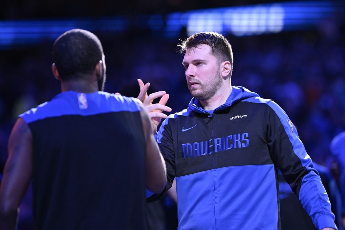 Dec 25, 2024; Dallas, Texas, USA; Dallas Mavericks guard Kyrie Irving (11) greets guard Luka Doncic (77) before the game against the Minnesota Timberwolves at the American Airlines Center. Mandatory Credit: Jerome Miron-Imagn Images