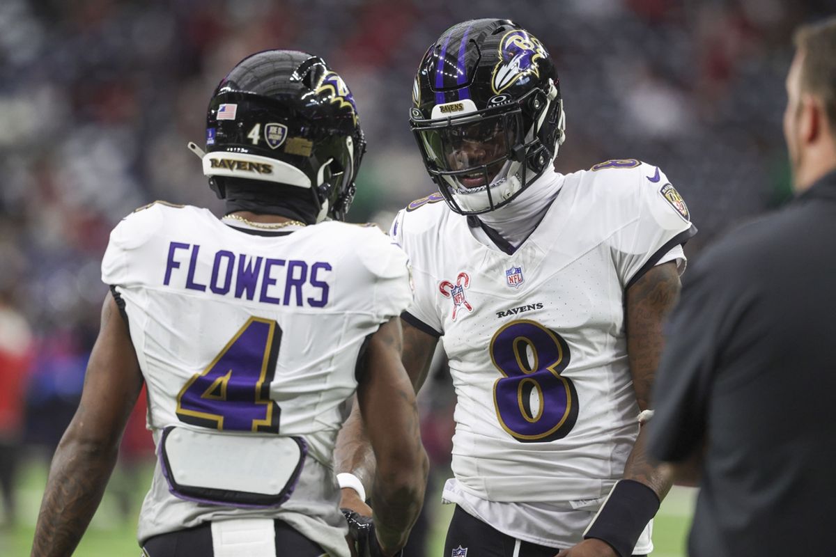 Baltimore Ravens quarterback Lamar Jackson (8) shakes hands with wide receiver Zay Flowers (4) before the game against the Houston Texans at NRG Stadium. Mandatory Credit: Troy Taormina-Imagn Images