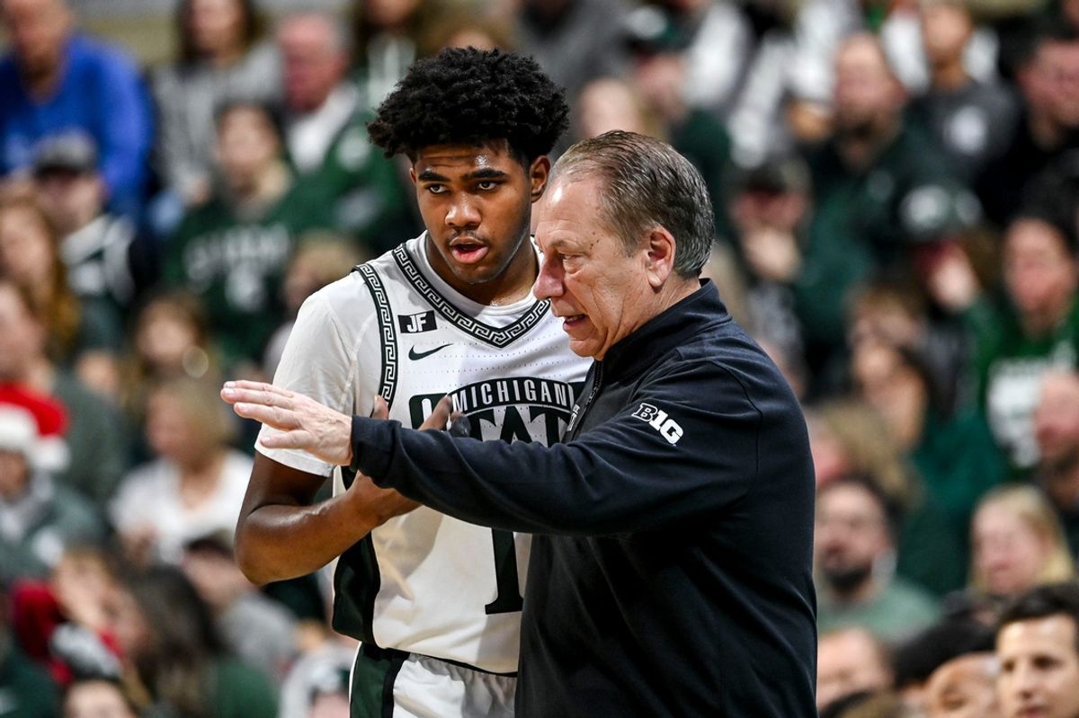 Michigan State's Jase Richardson, left, talks with head coach Tom Izzo during a break in the action in the game against Florida Atlantic on Saturday, Dec. 21, 2024, in East Lansing.