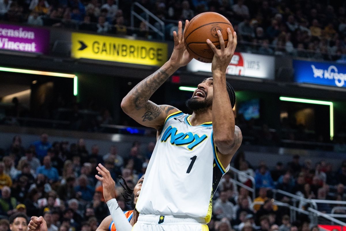Dec 26, 2024; Indianapolis, Indiana, USA; Indiana Pacers forward Obi Toppin (1) shoots the ball while Oklahoma City Thunder guard Isaiah Joe (11) defends in the first half at Gainbridge Fieldhouse. Mandatory Credit: Trevor Ruszkowski-Imagn Images