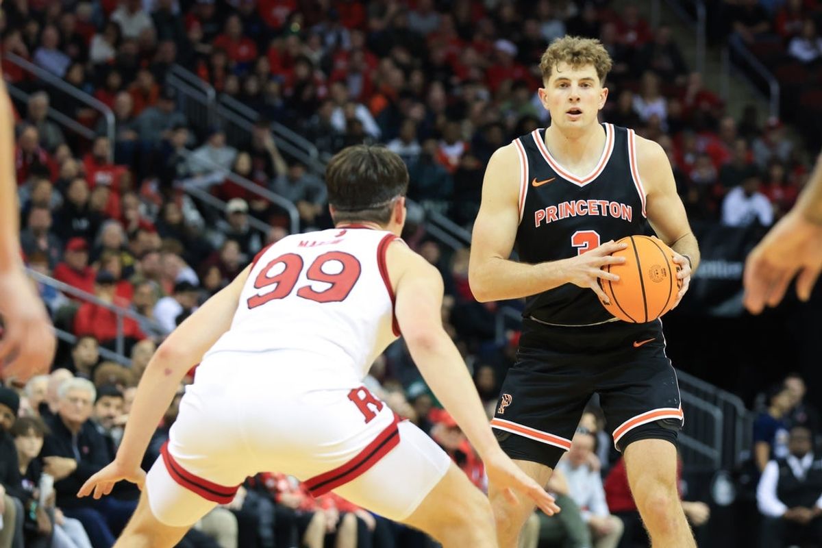 Dec 21, 2024; Newark, New Jersey, USA; Princeton Tigers forward Caden Pierce (3) looks to pass while being defended by Rutgers Scarlet Knights center Zach Martini (99) during the second half at Prudential Center. Mandatory Credit: Tom Horak-Imagn Images