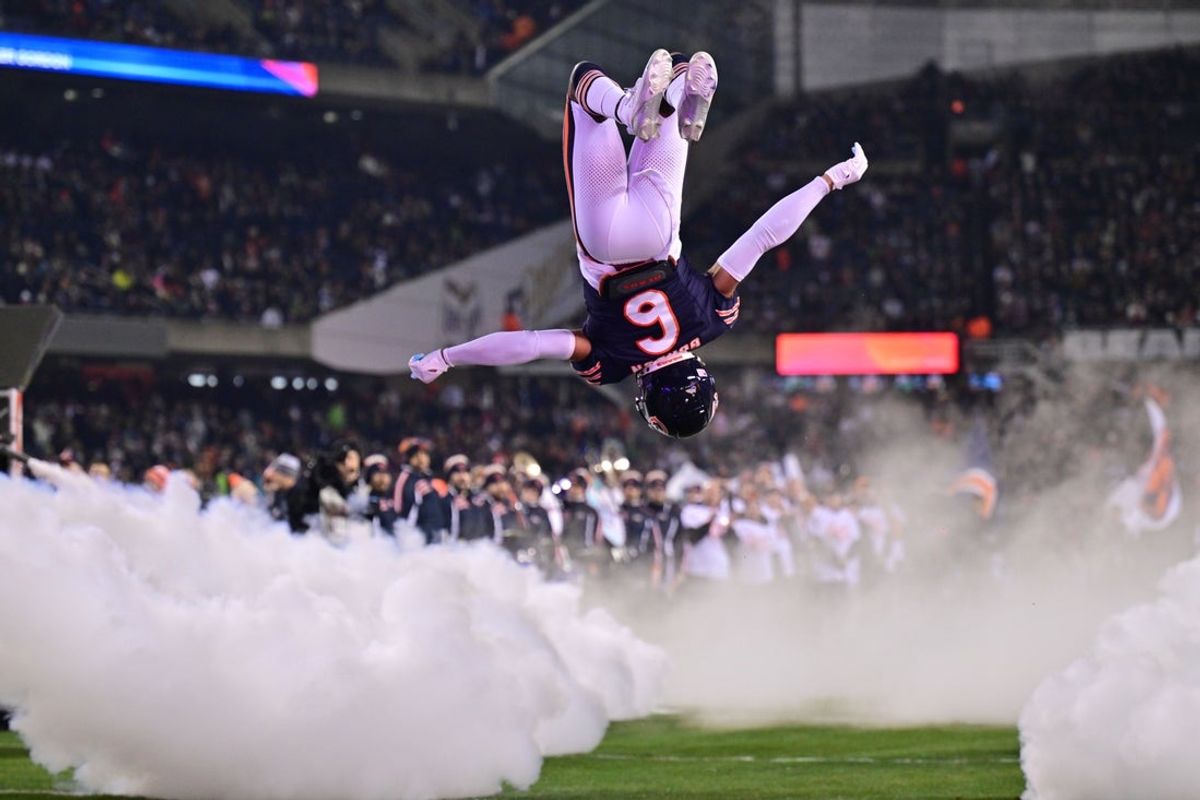 Dec 26, 2024; Chicago, Illinois, USA; Chicago Bears cornerback Kyler Gordon (6) does a back flip as he enters the field before the game against the Seattle Seahawks at Soldier Field. Mandatory Credit: Daniel Bartel-Imagn Images