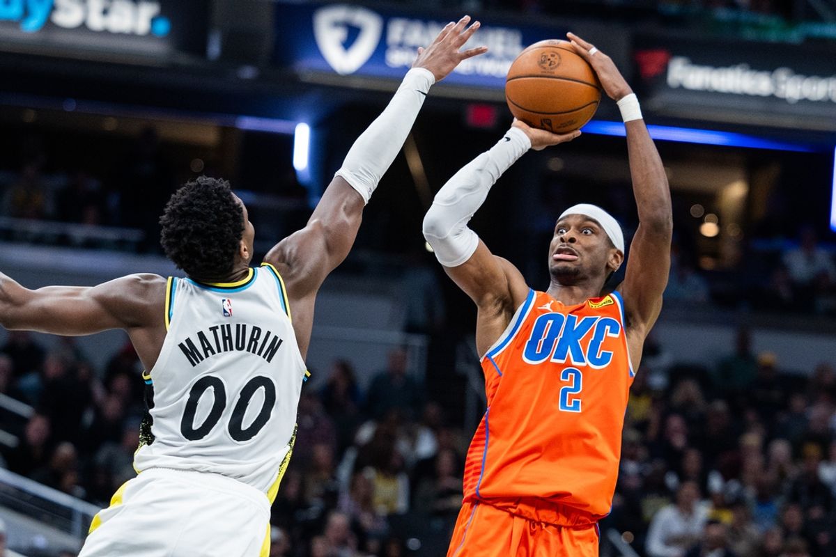 Dec 26, 2024; Indianapolis, Indiana, USA; Oklahoma City Thunder guard Shai Gilgeous-Alexander (2) shoots the ball while Indiana Pacers guard Bennedict Mathurin (00) defends in the second half at Gainbridge Fieldhouse. Mandatory Credit: Trevor Ruszkowski-Imagn Images