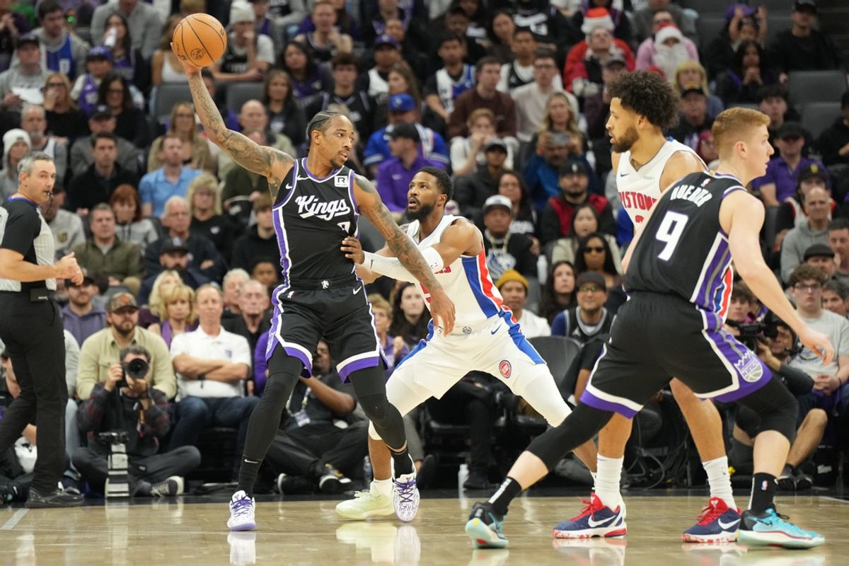 Dec 26, 2024; Sacramento, California, USA; Sacramento Kings forward/guard DeMar DeRozan (10) controls the ball against Detroit Pistons guard Malik Beasley (5) during the first quarter at Golden 1 Center. Mandatory Credit: Kelley L Cox-Imagn Images