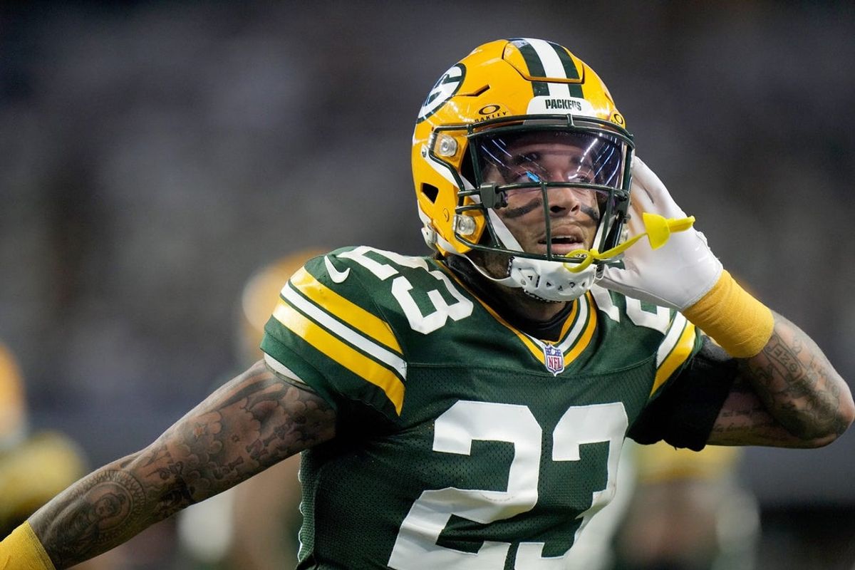 Green Bay Packers cornerback Jaire Alexander (23) reacts after intercepting a pass during the first quarter of the wild card playoff game against the Dallas Cowboys Sunday, January 14, 2024 at AT&T Stadium in Arlington, Texas.