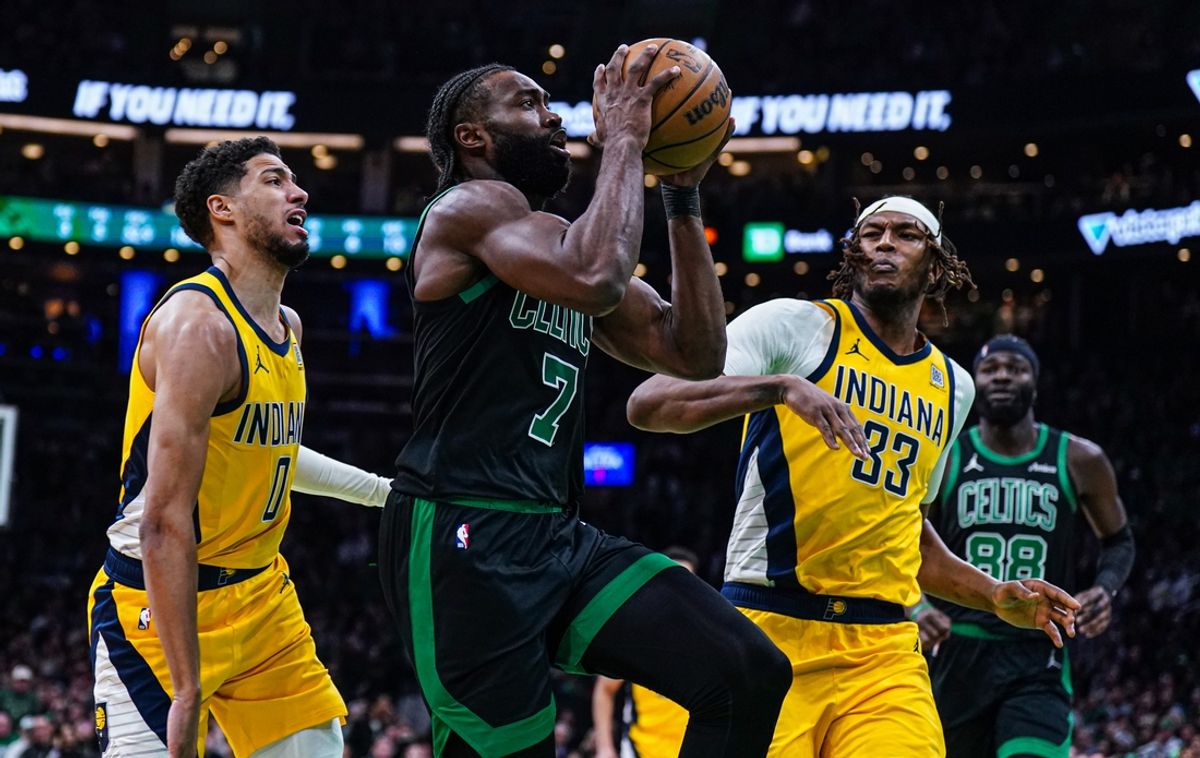 Dec 27, 2024; Boston, Massachusetts, USA; Boston Celtics guard Jaylen Brown (7) drives the ball against Indiana Pacers guard Tyrese Haliburton (0) and center Myles Turner (33) in the second quarter at TD Garden. Mandatory Credit: David Butler II-Imagn Images