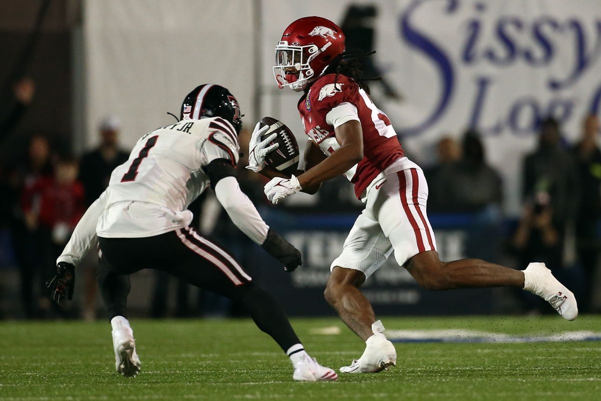 Dec 27, 2024; Memphis, TN, USA; Arkansas Razorbacks wide receiver Dazmin James (83) runs after a catch during the second quarter against the Texas Tech Red Raiders at Simmons Bank Liberty Stadium. Mandatory Credit: Petre Thomas-Imagn Images