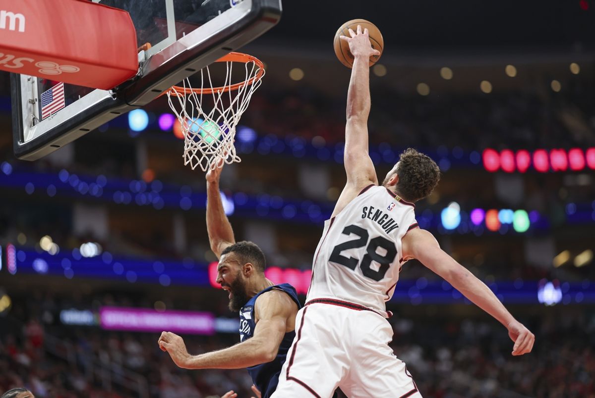 Dec 27, 2024; Houston, Texas, USA; Houston Rockets center Alperen Sengun (28) attempts to defend a shot by Minnesota Timberwolves center Rudy Gobert (27) but is called for a foul during the second quarter at Toyota Center. Mandatory Credit: Troy Taormina-Imagn Images