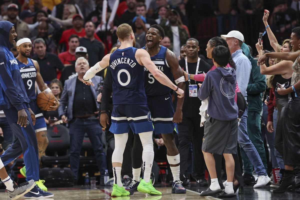 Dec 27, 2024; Houston, Texas, USA; Minnesota Timberwolves guard Anthony Edwards (5) celebrates with guard Donte DiVincenzo (0) after the Timberwolves defeated the Houston Rockets at Toyota Center. Mandatory Credit: Troy Taormina-Imagn Images
