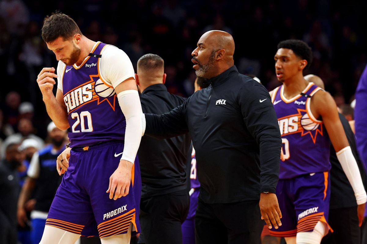 Dec 27, 2024; Phoenix, Arizona, USA; Phoenix Suns center Jusuf Nurkic (20) walks off the court after being punched by Dallas Mavericks forward Naji Marshall (not pictured) at Footprint Center. Mandatory Credit: Mark J. Rebilas-Imagn Images