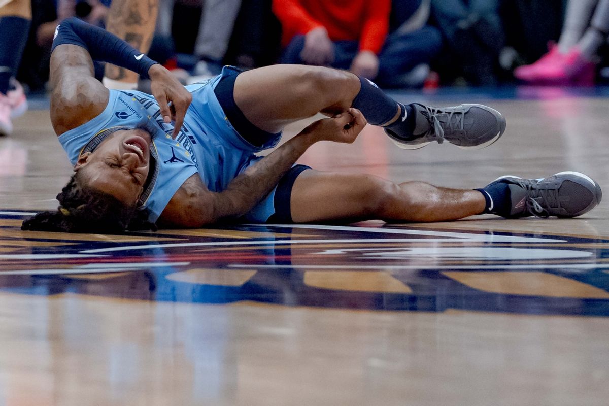 Dec 27, 2024; New Orleans, Louisiana, USA; Memphis Grizzlies guard Ja Morant (12) reacts after a screen by New Orleans Pelicans center Daniel Theis (10) during the third quarter at Smoothie King Center. Mandatory Credit: Matthew Hinton-Imagn Images