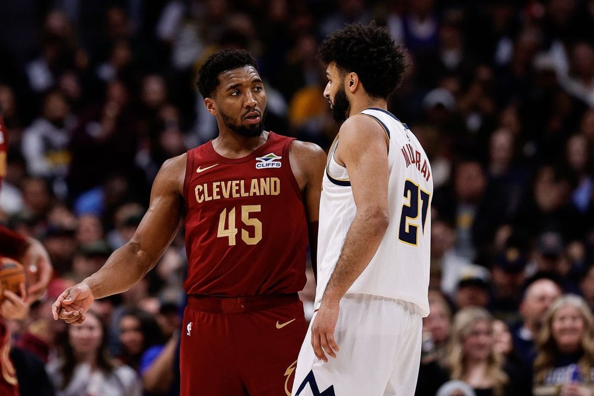 Dec 27, 2024; Denver, Colorado, USA; Cleveland Cavaliers guard Donovan Mitchell (45) talks with Denver Nuggets guard Jamal Murray (27) after a play in the third quarter at Ball Arena. Mandatory Credit: Isaiah J. Downing-Imagn Images