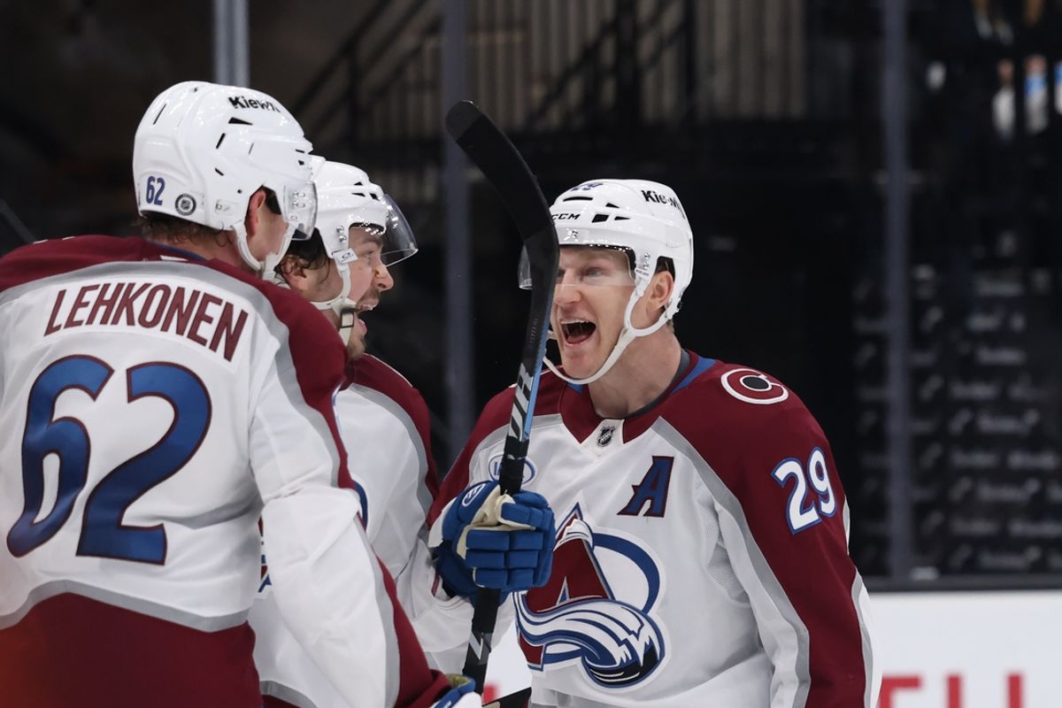 Dec 27, 2024; Salt Lake City, Utah, USA; Colorado Avalanche left wing Artturi Lehkonen (62) celebrates a goal with center Nathan MacKinnon (29) during the third period at Delta Center. Mandatory Credit: Rob Gray-Imagn Images
