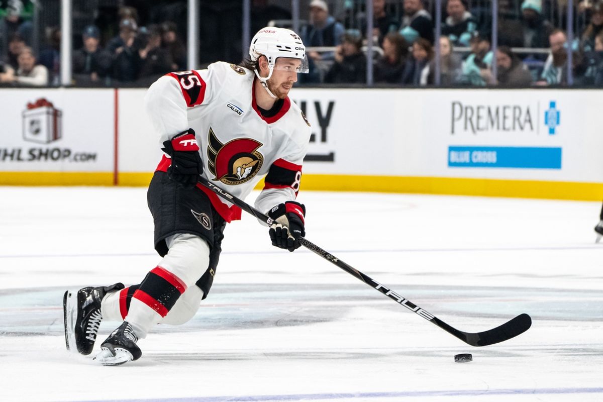 Dec 17, 2024; Seattle, Washington, USA;  Ottawa Senators defenseman Jake Sanderson (85) skates with the puck against the Seattle Kraken at Climate Pledge Arena. Mandatory Credit: Stephen Brashear-Imagn Images