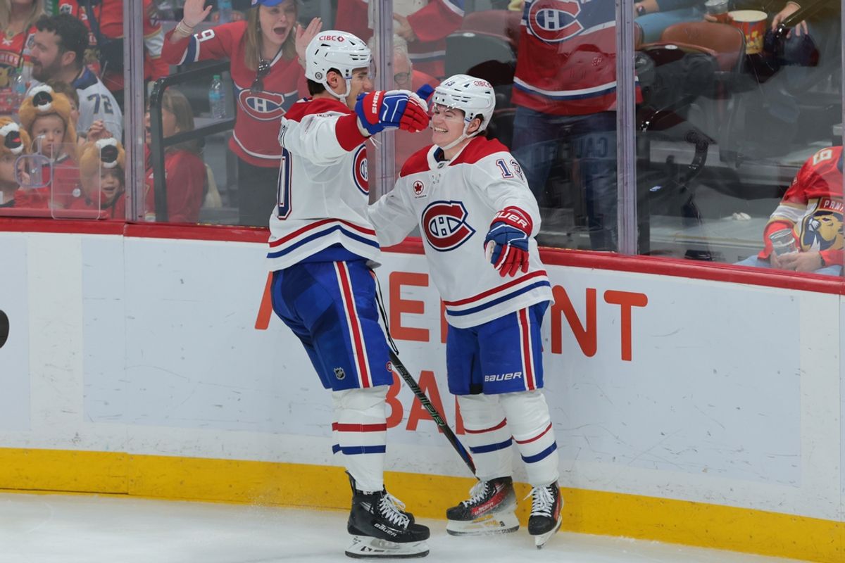Dec 28, 2024; Sunrise, Florida, USA; Montreal Canadiens right wing Cole Caufield (13) celebrates with left wing Juraj Slafkovsky (20) after scoring against the Florida Panthers during the third period at Amerant Bank Arena. Mandatory Credit: Sam Navarro-Imagn Images