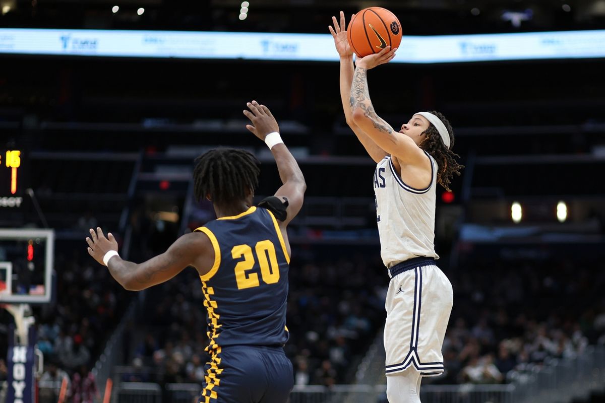 Dec 28, 2024; Washington, District of Columbia, USA; Georgetown Hoyas guard Malik Mack (2) shoots the ball against Coppin State Eagles guard Darius Leonard (20) during the first half at Capital One Arena. Mandatory Credit: Daniel Kucin Jr.-Imagn Images
